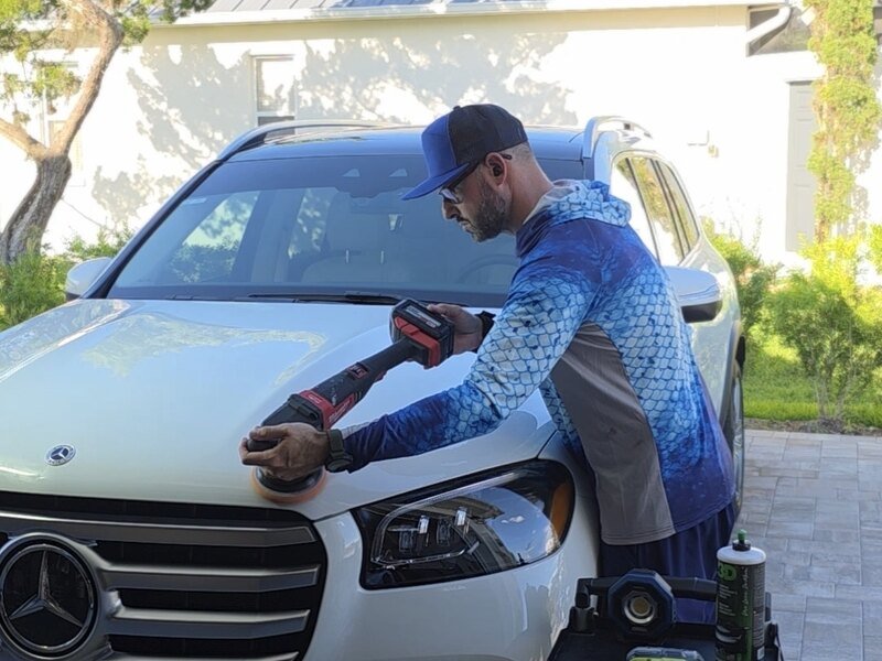 Flagship Detailing owner working on a vehicle